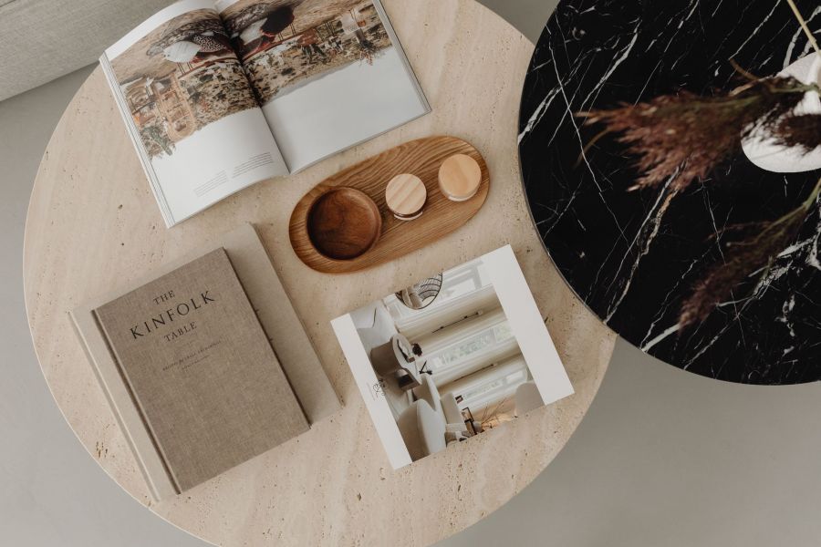 Stone and marble round tables with books and home decor